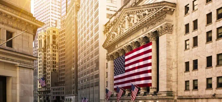 Wall Street buildingd with US flags